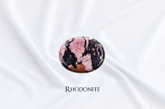 10 Rhodonite Gemstone Symbolism Facts & Meaning: Zodiac, Superstitions, Dreams, and Myths